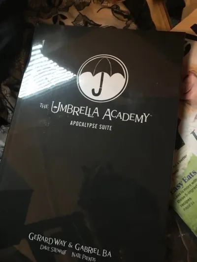Umbrella Academy book and a Funko Pop