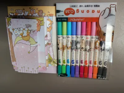 Pens and memo pads plus stickers! Oh and postcards!